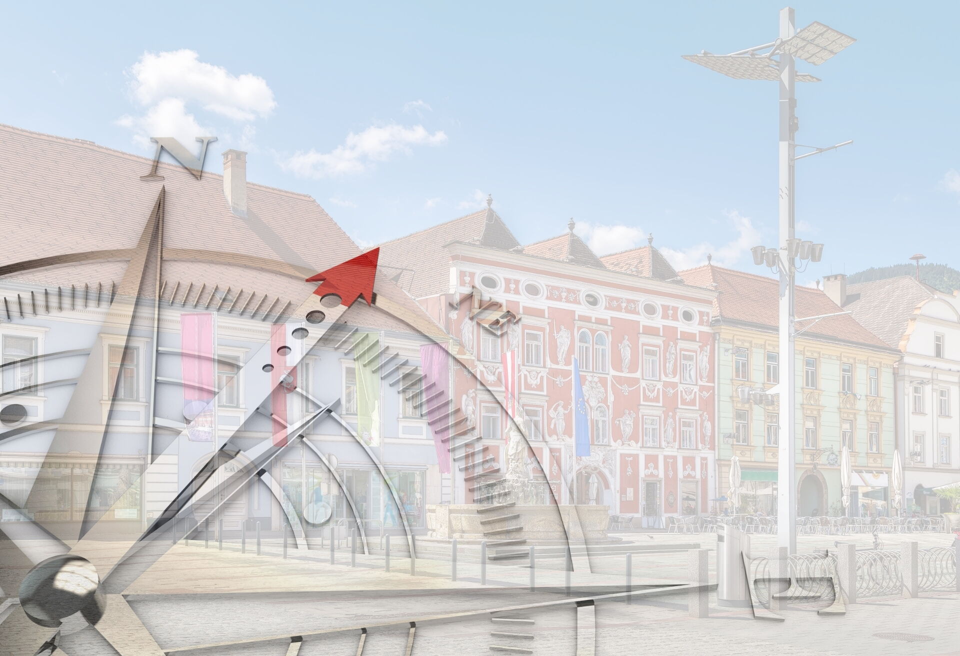 Image of the main square in Leoben with focus on the Hackhaus overlaid by part of a compass rose © canva