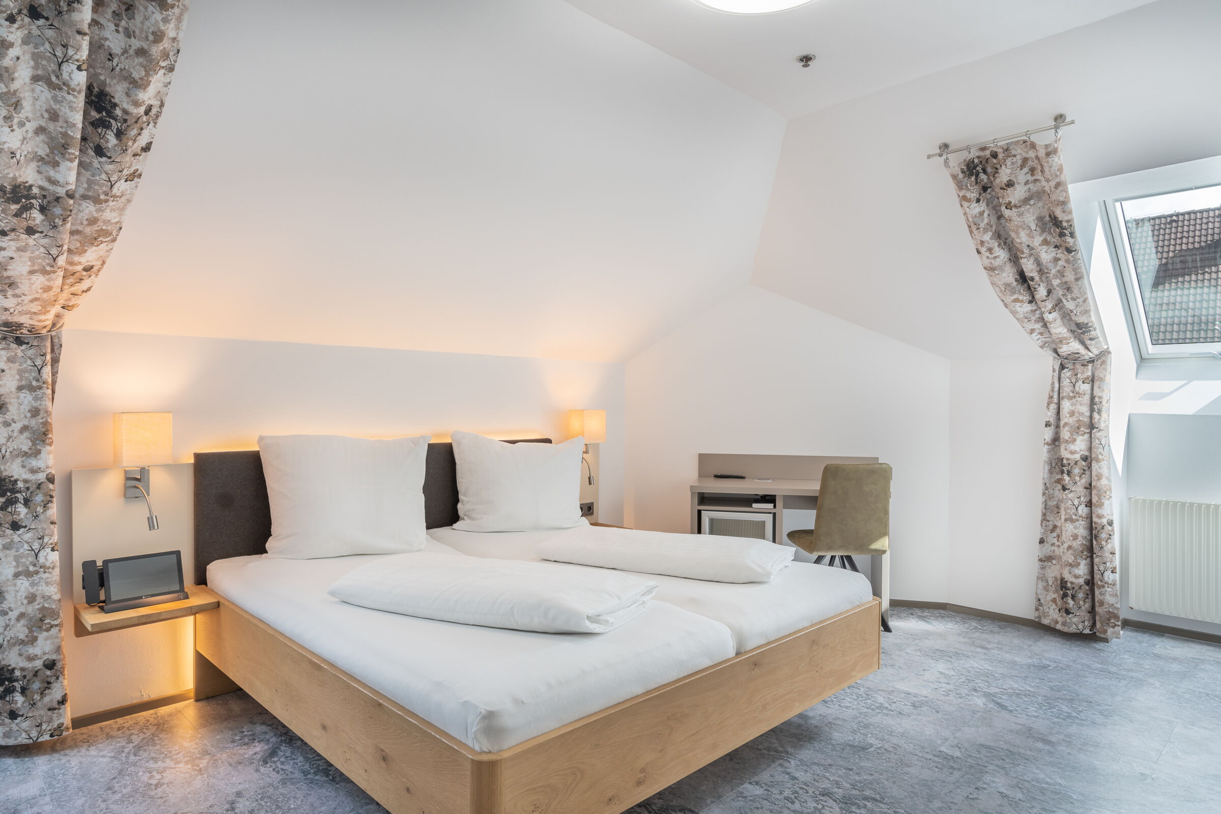 Double bed in modern Greenwing room