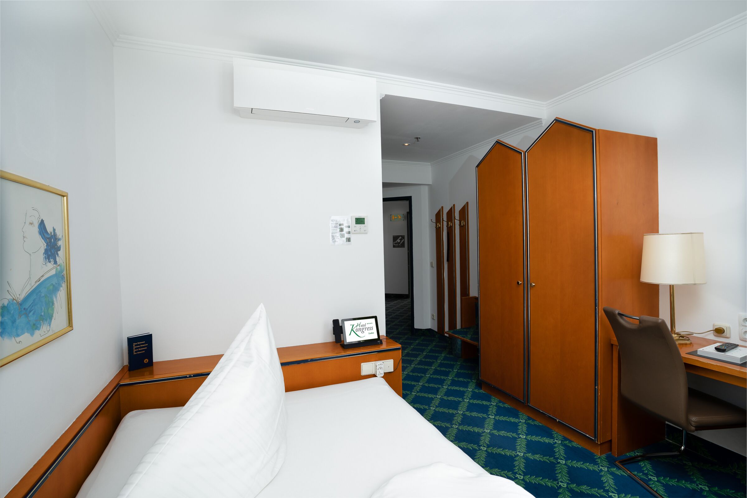 Large wooden wardrobe in single bed room