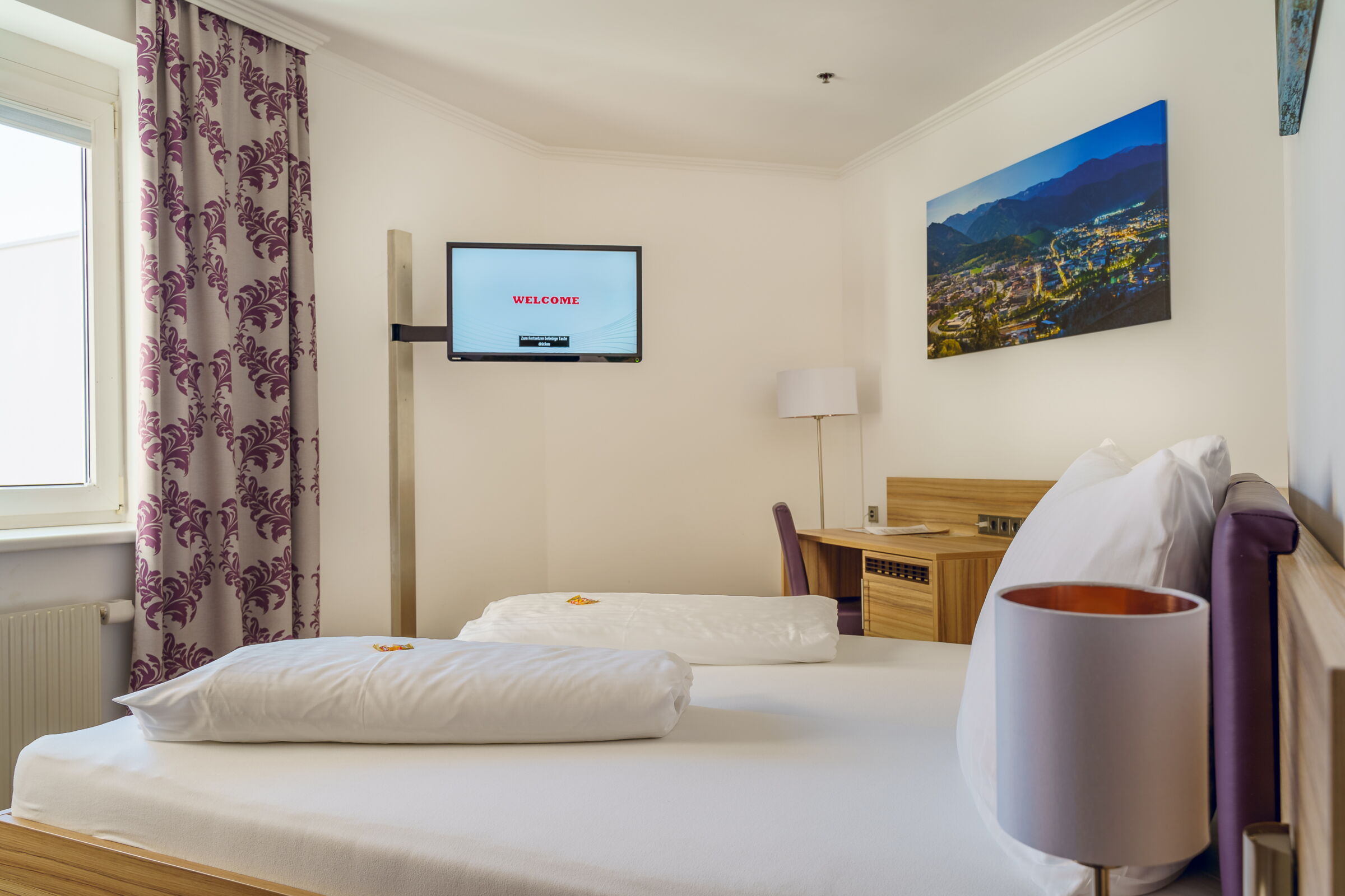 Fernseher an de Wand montiert