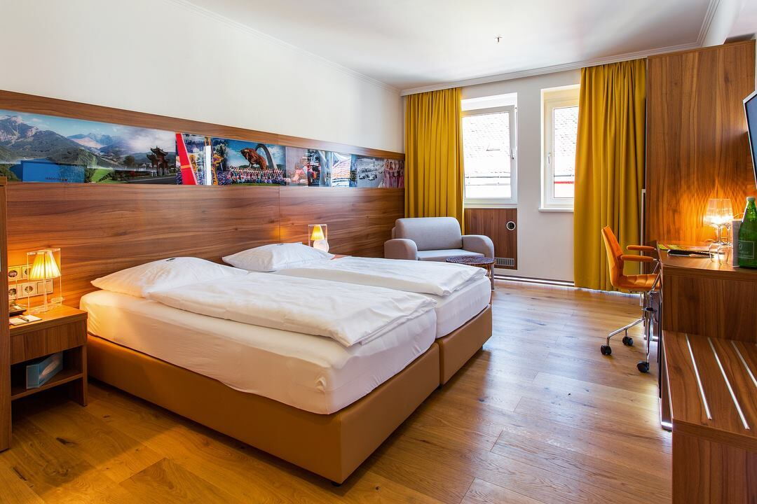 Double bed in modern room with wooden look