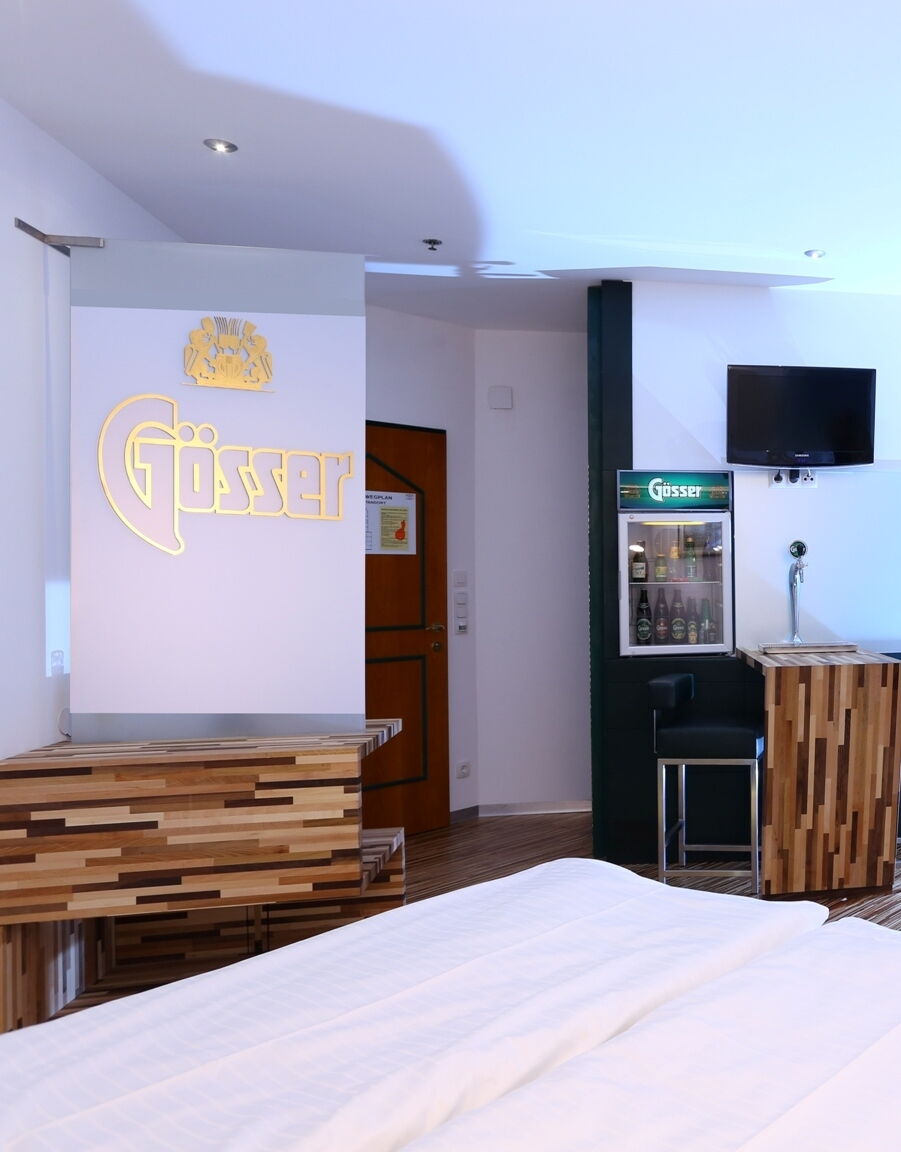 illuminated Gösser logo on the wall